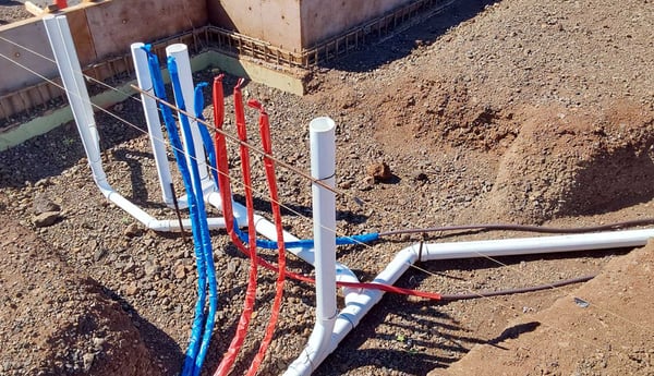 Closeup-of-plumbing-and-electrical-in-place-before-foundation-header-1