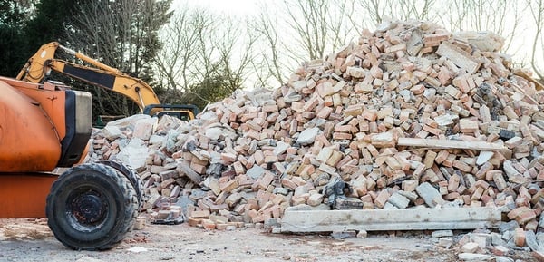 Demolition-services-sowing-a-pipe-of-bricks-and-a-front-end-loader-1