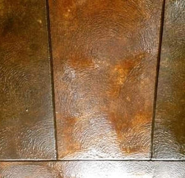 Hand stamped concrete designed to look like wood flooring.