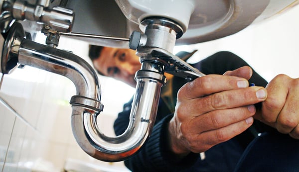 Replumbing-repairing-a-pipe-leak-under-a-sink-1