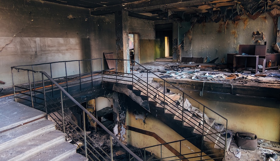Fire-Restoration-in-a-burned-out-commercial-building-showing-walls-and-staircases-in-black-soot Fire-Restoration-in-a-burned-out-commercial-building-showing-walls-and-staircases-in-black-soot