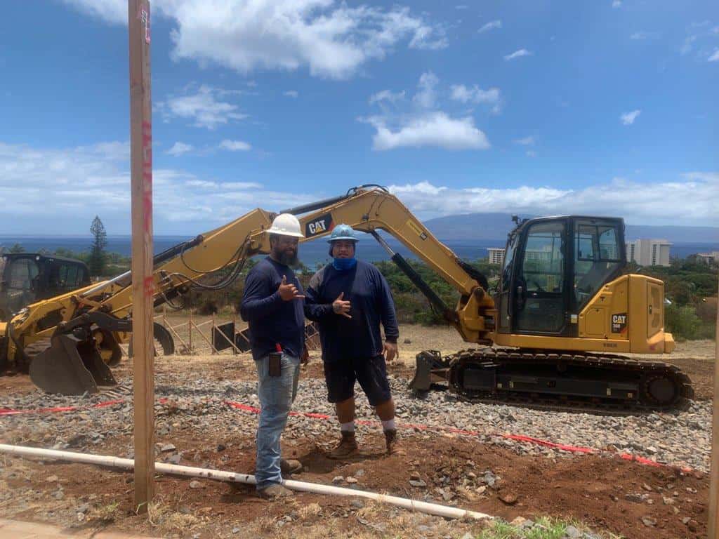 Crescent Homes Maui heavy equipment operators preparing a home site for construction. When you pick the right contractor pick the one with safe operations.