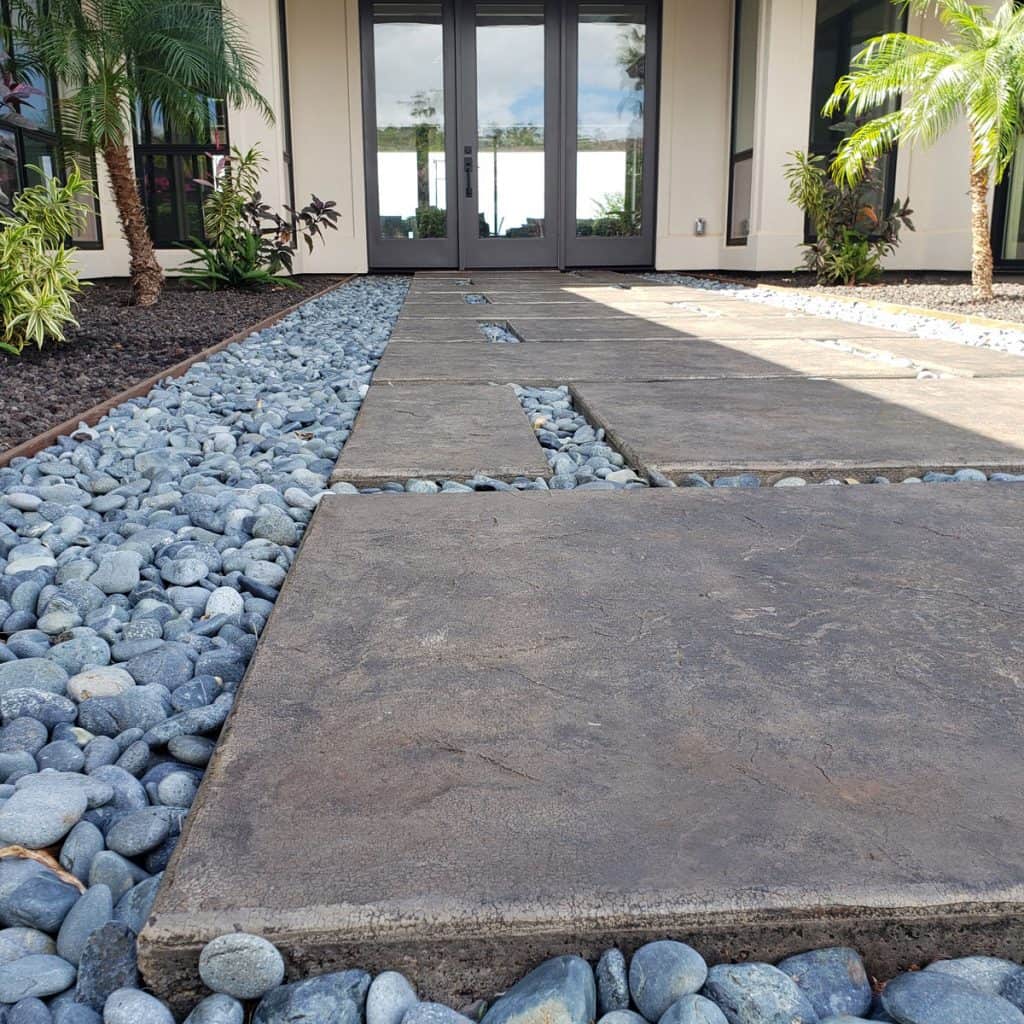 Another look at the stamped concrete pads surrounded by decorative stones.
