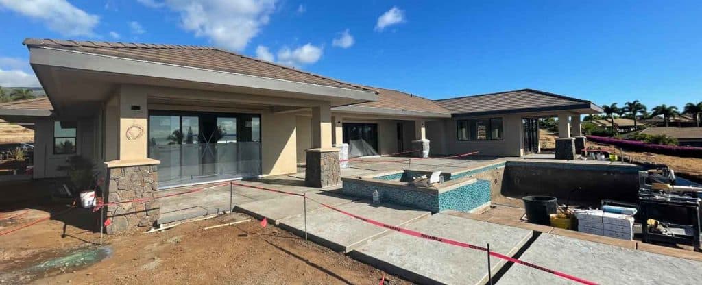 New Maui dream home with a recently poured and stamped concrete walkway